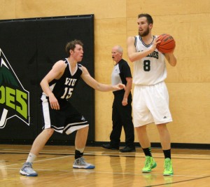 UFV`s Jasper Moedt sizes up the defence as VIU`s Jerod Dorby closes in.