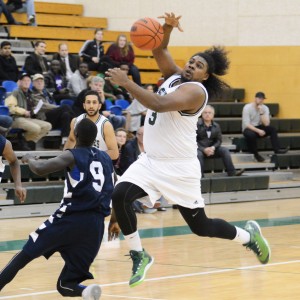 Mount Royal's Manok Atwal (No. 9) did his best to disrupt UFV's Nate Brown on the fast break.