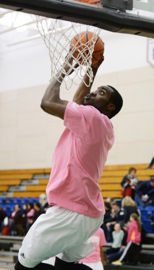 Kadeem Willis and his UFV men's basketball teammates wore pink T-shirts in warm-ups in support of the women's basketball team's Shoot for the Cure fundraiser for breast cancer research.