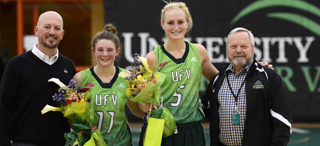 UFV interim athletic director Chris Bertram (left) and president Mark Evered (right) celebrated the careers of graduating fifth-year Cascades Celeste Dyck and Sarah Wierks on Saturday.