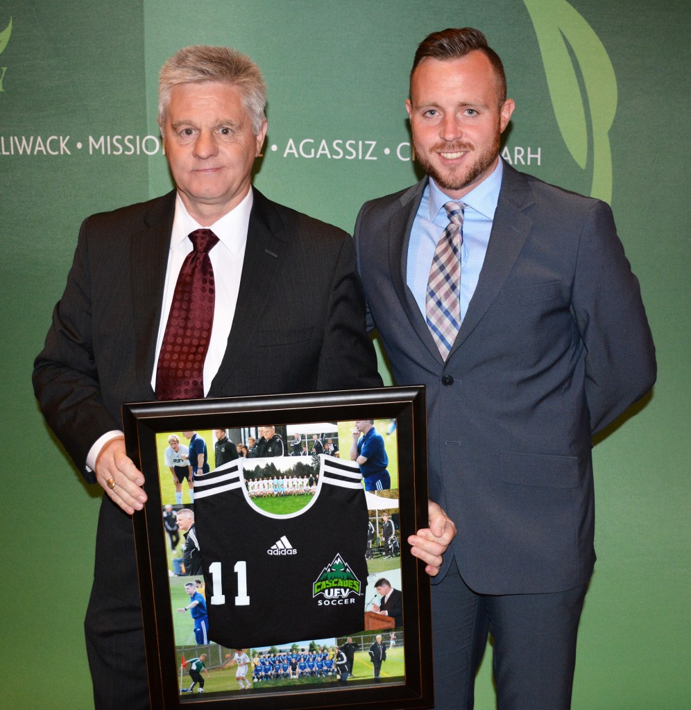 Tom Lowndes, Alan Errington's successor at the helm of the Cascades men's soccer program, presented Errington with a framed jersey during the UFV athletic awards banquet on Tuesday in honour of his retirement.