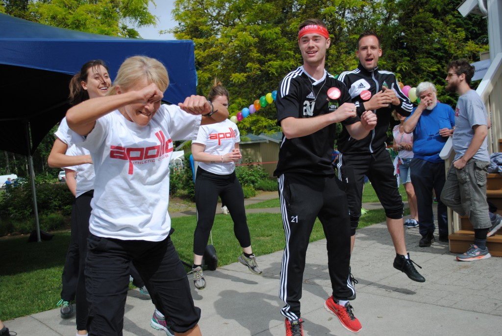 Cascades men's soccer players James Najman and Mark Village helped lead the warm-up at the 2014 Abbotsford Gutsy Walk.