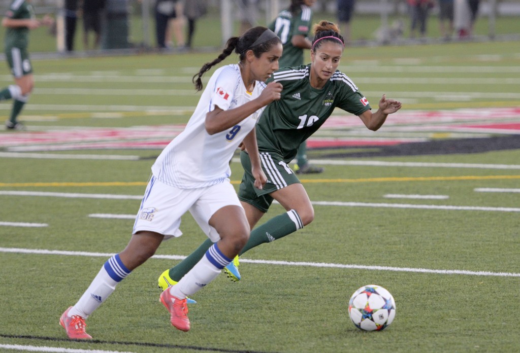 UFV's Harman Billen (right) closes in on UBC's Jasmin Dhanda on Saturday evening.