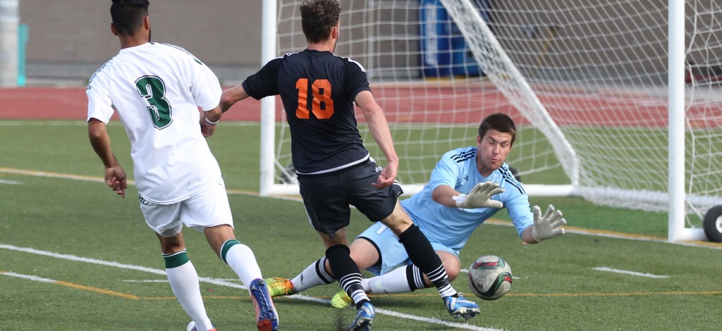 Cascades keeper Alex Skrzeta turns aside a shot from TRU's Mitchell Popadynetz.(Andrew Snucins photos)