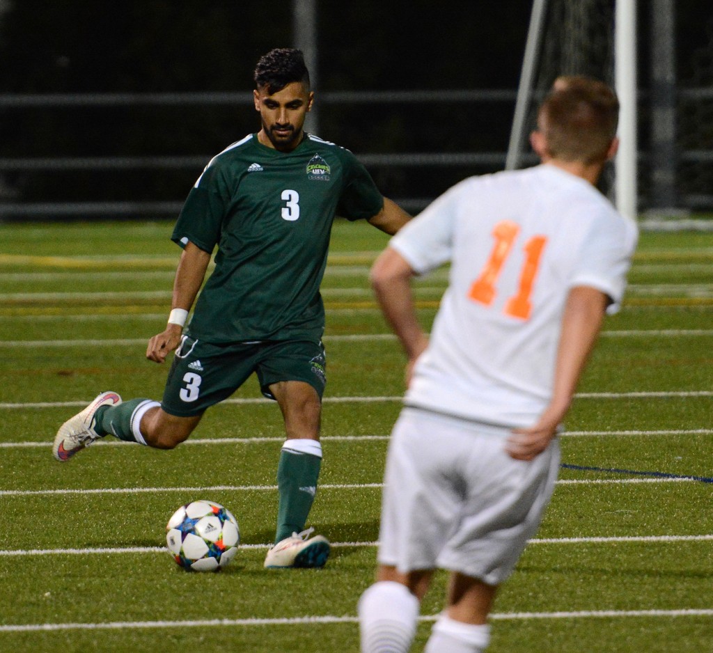 Cascades defender Sukhjit Dhaliwal plays the ball ahead during Saturday's home game vs. Thompson Rivers.