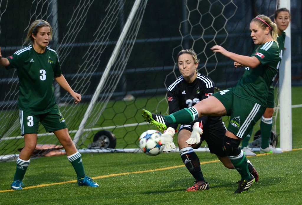 Cascades defender Dayle Jeras (right) and keeper Emily Harold combined to keep a Winnipeg Wesmen corner from finding its way into the net on Saturday.