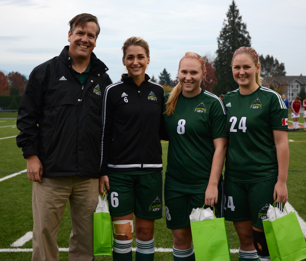 Graduating fifth-years Jade Palm, Shelby Beck and Dayle Jeras were honoured during a pregame ceremony with Cascades athletic director Steve Tuckwood.