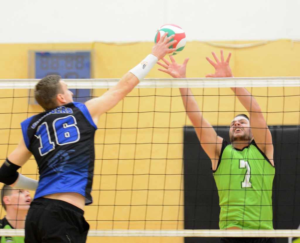 Cascades middle Dayton Pagliericci goes up for a block against the Camosun Chargers on Friday evening.