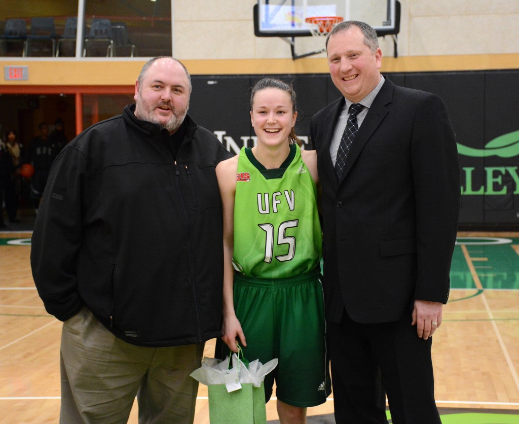 Fifth-year player Shayna Cameron posed with assistant coach Sean Bosko and head coach Al Tuchscherer after Saturday's win.