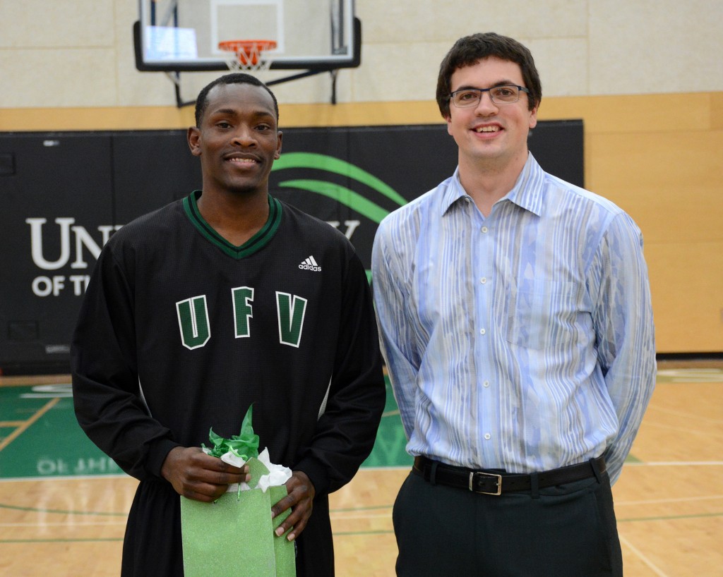 Kevon Parchment posed with head coach Adam Friesen in a Senior Night ceremony prior to the game.