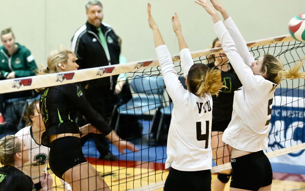 Cascades middle Monique Huber works around a VIU Mariners block during Friday's PacWest semifinal match at Columbia Bible College.