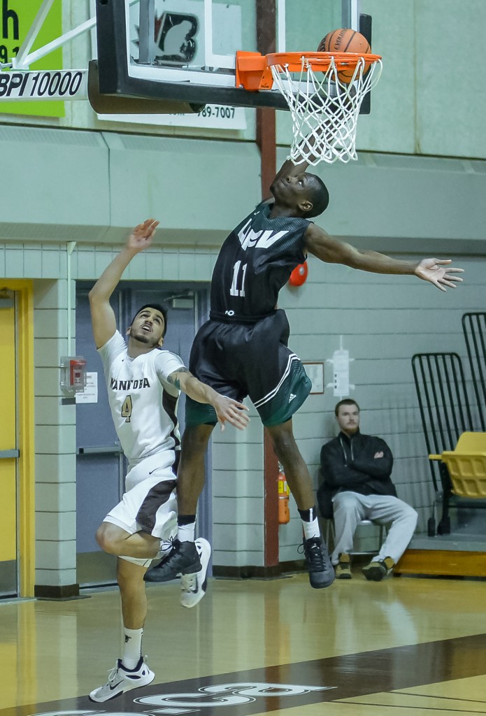 Kevon Parchment soars to the hoop against the Manitoba Bisons.