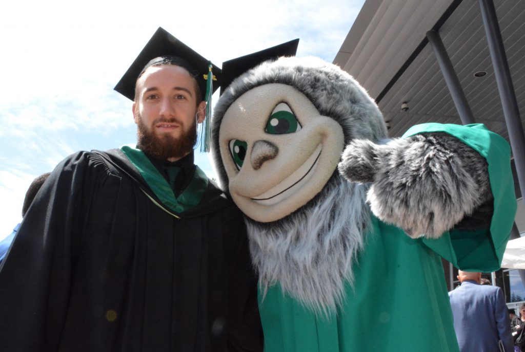 Cascades men's volleyball player Adam Chaplin spent some time with mascot Sasq'ets.