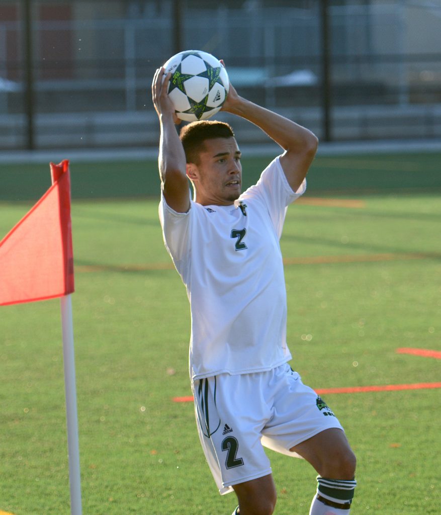 Rookie right back Ryan Donald looks for a target on a first-half throw-in.