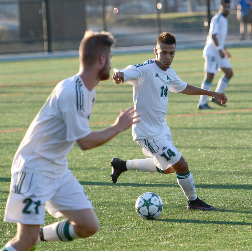 UFV's Connor MacMillan prepares to send a pass into the path of teammate James Najman.