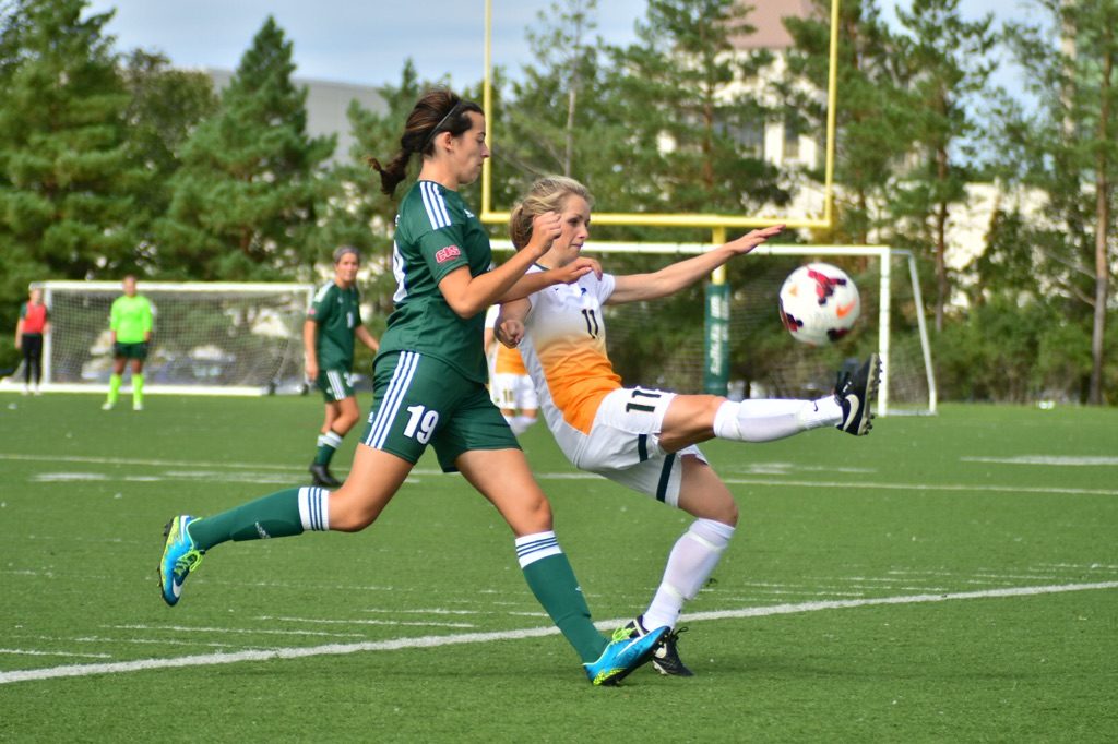 Cascades midfielder Brittney Zacharuk and Regina's Karlee Vorrieter battle for the ball.