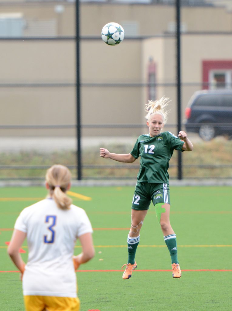 Karlee Pedersen of the Cascades rises for a header.