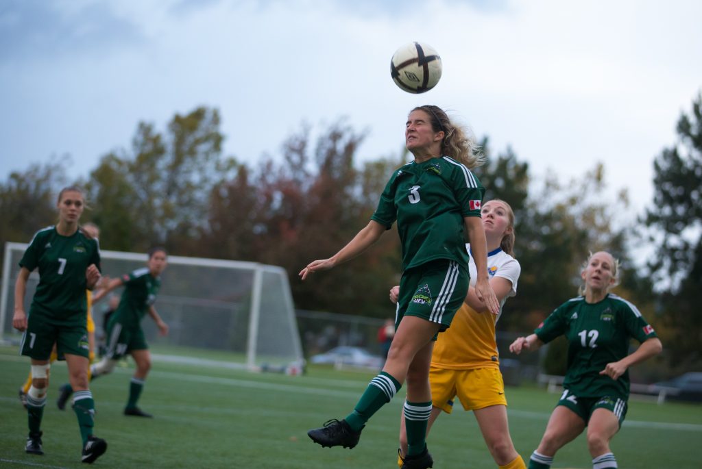 Danica Kump goes up for a header.