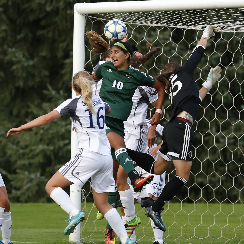 UFV's Simi Lehal leaps for a header.