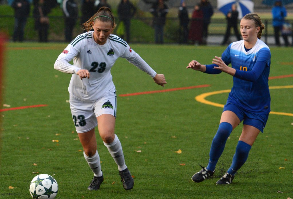 Cascades defender Desiree Caruso clears the ball away from a UVic opponent.