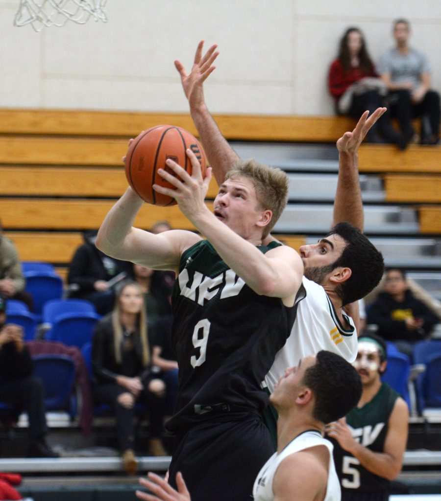 UFV's Andrew Morris drives for a layup.