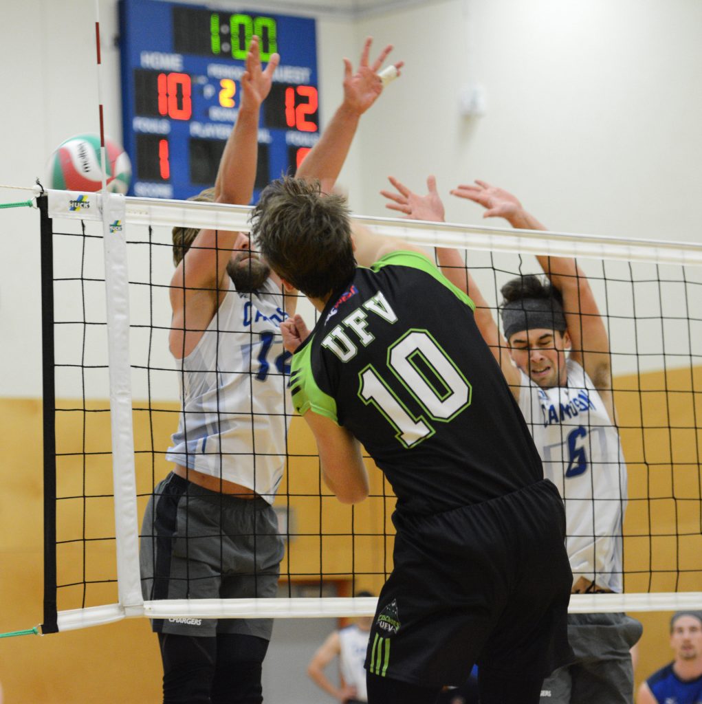 Ben Friesen hammers one of his 17 kills through the Chargers' block.