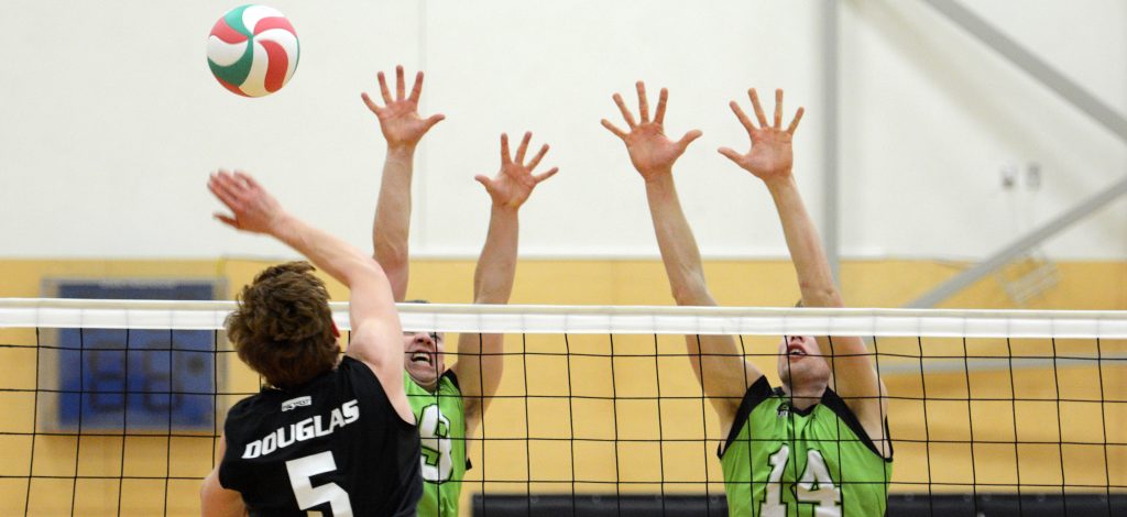 UFV's Adam Frederickson and Connor Pruim go up for a block against the Douglas Royals on Friday evening.