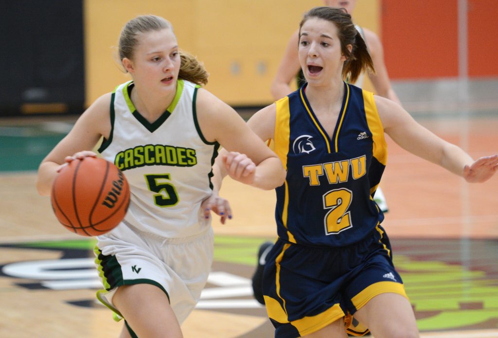 Victoria Jacobse drives past TWU's Mariah Perry.