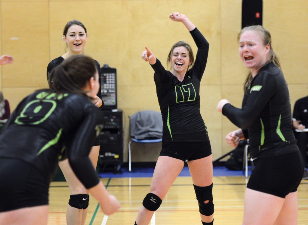 The Cascades' Mandelyn Erikson, Monique Huber, Jessica Funk and Rachel Funk (from left) celebrate a point during Saturday's win over Camosun.